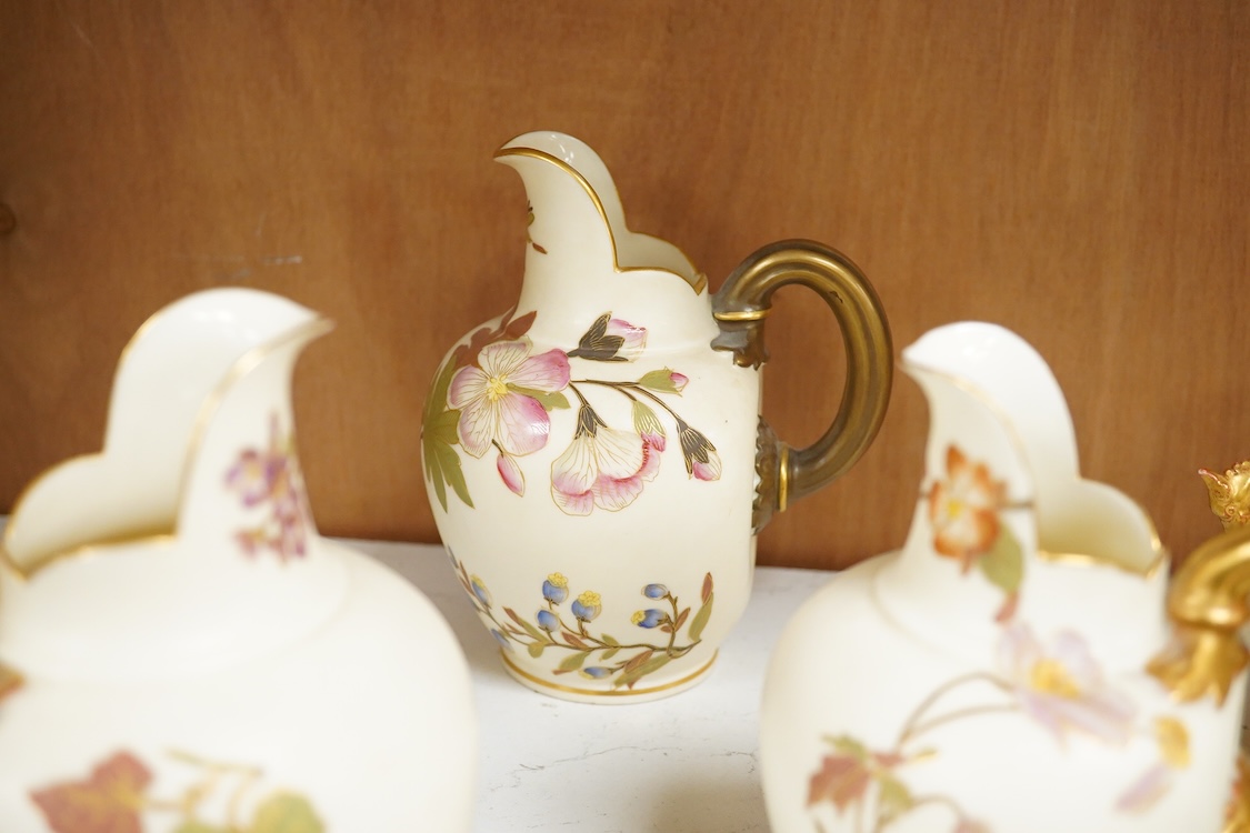 Three Royal Worcester blush ivory jugs, shape 1094, a pair of similar vases and two other Royal Worcester items, the jugs 14cm (7)